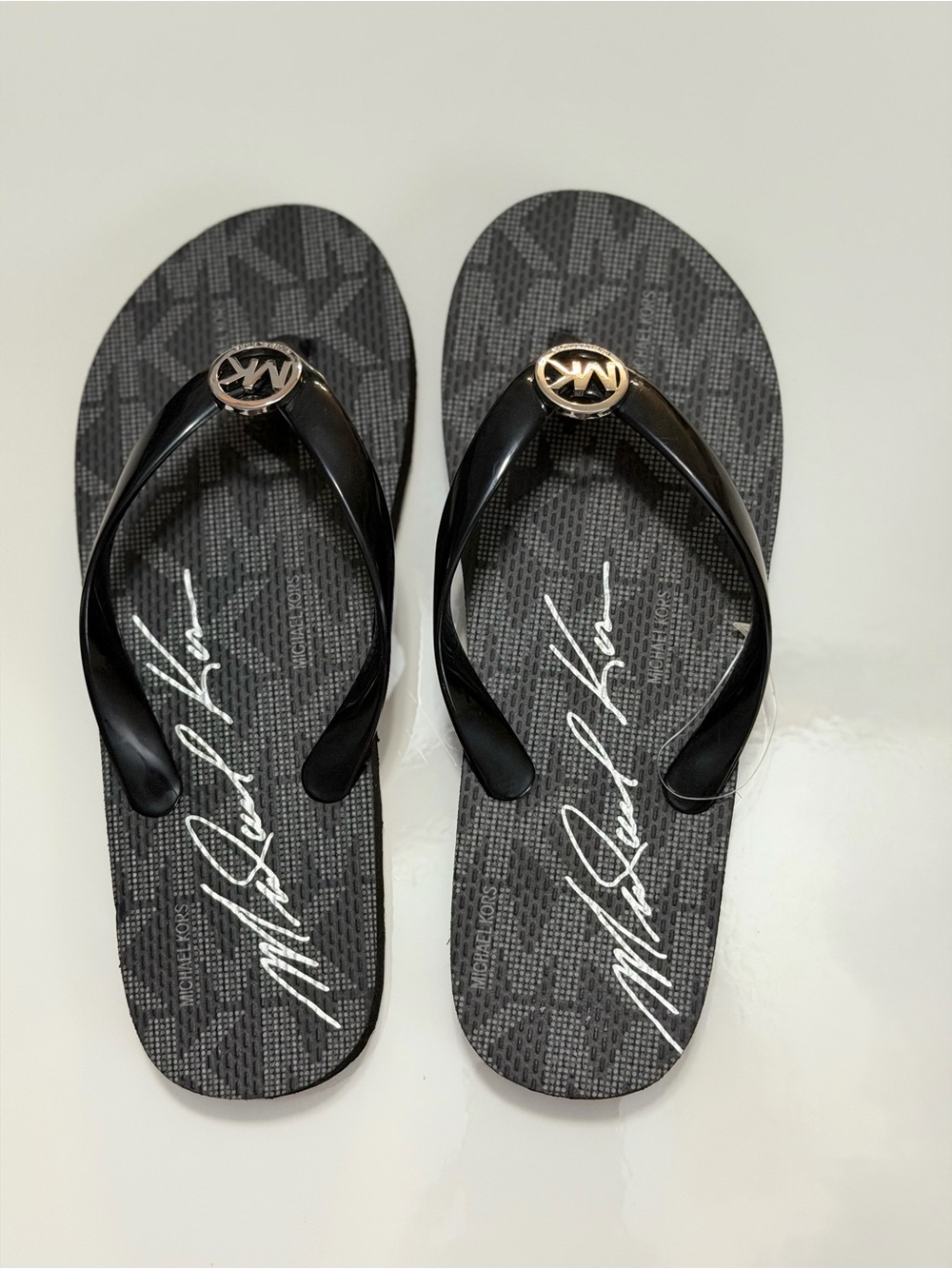 Michael Kors Black Flip Flops with Gold MK Emblem